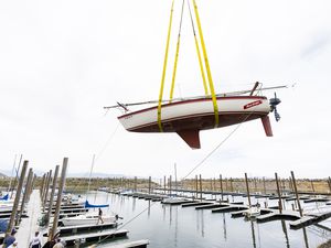 (Rick Egan | The Salt Lake Tribune)  Cranes lowering boats into the water at Great Salt Lake Marina State Park, on Tuesday, June 6, 2023.
