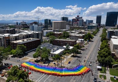 (Francisco Kjolseth | The Salt Lake Tribune) The large rainbow flag that takes up the rear of the Utah Pride Parade is carried in Salt Lake City on Sunday, June 4, 2023.